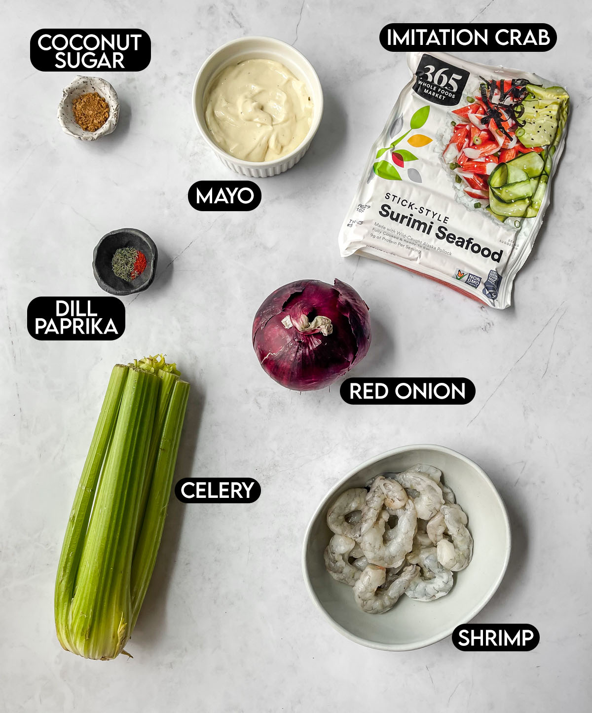 Labeled ingredients needed for seafood salad: coconut sugar, imitation crab, mayo, dill, paprika, red onion, celery, shrimp.
