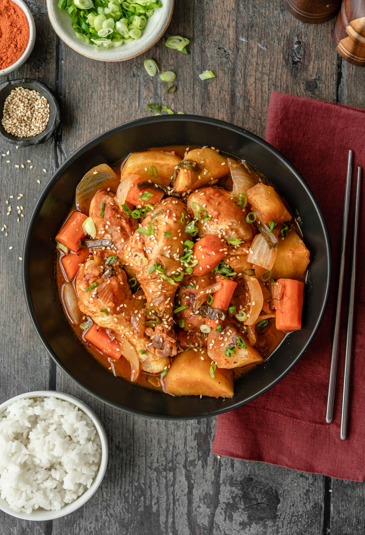 This homemade Instant Pot Dak Dori Tang is the perfect meal to make for dinner! Chicken drumsticks are cooked in a sweet and spicy marinade with onion, potatoes, and carrots. This classic Korean soup is cozy, delicious, and easy! One pot, dairy free, 35 minutes.